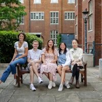 Group photo of 2023/24 Officer Trustees, sitting on a bench in Beit Quad